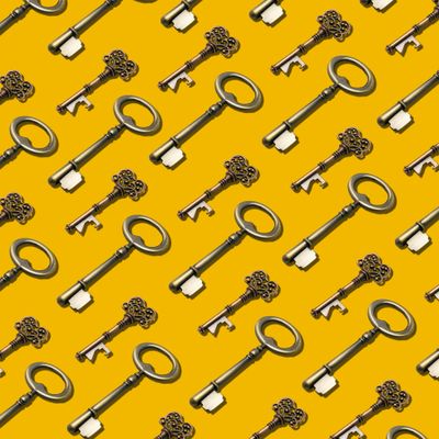Graphic of repeating old-fashioned keys laid out diagonally against a bright yellow background